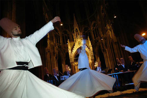 Whirling dervishes dancing in a Catholic Church